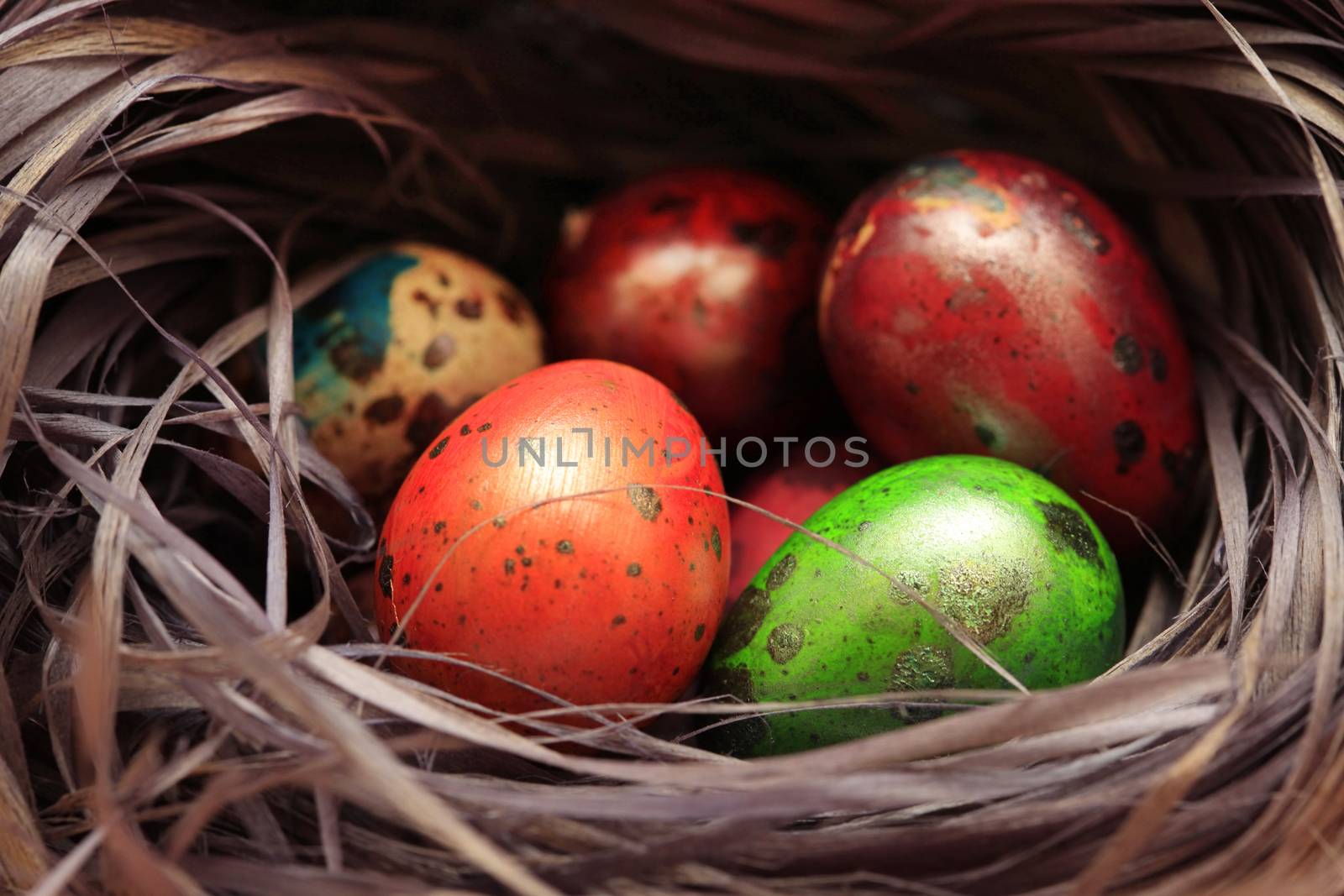 Colorful Speckled Easter Egg in the hay