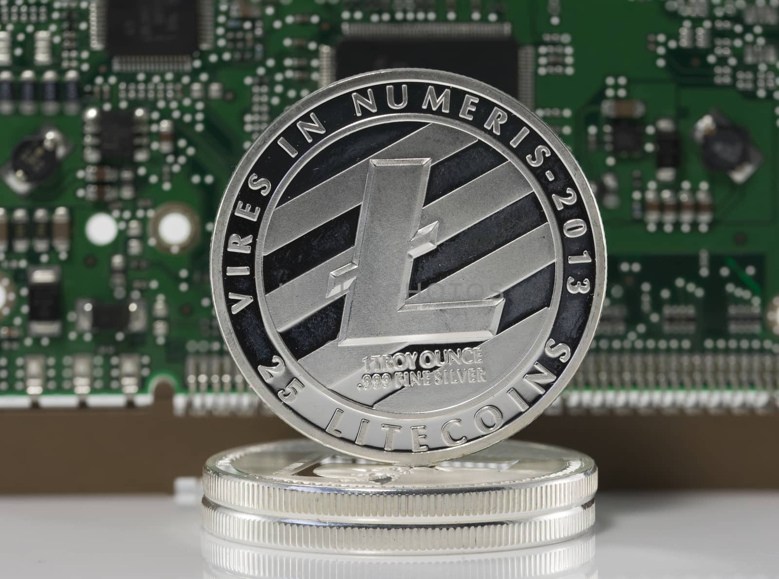 silver litecoin or ltc with computer print background