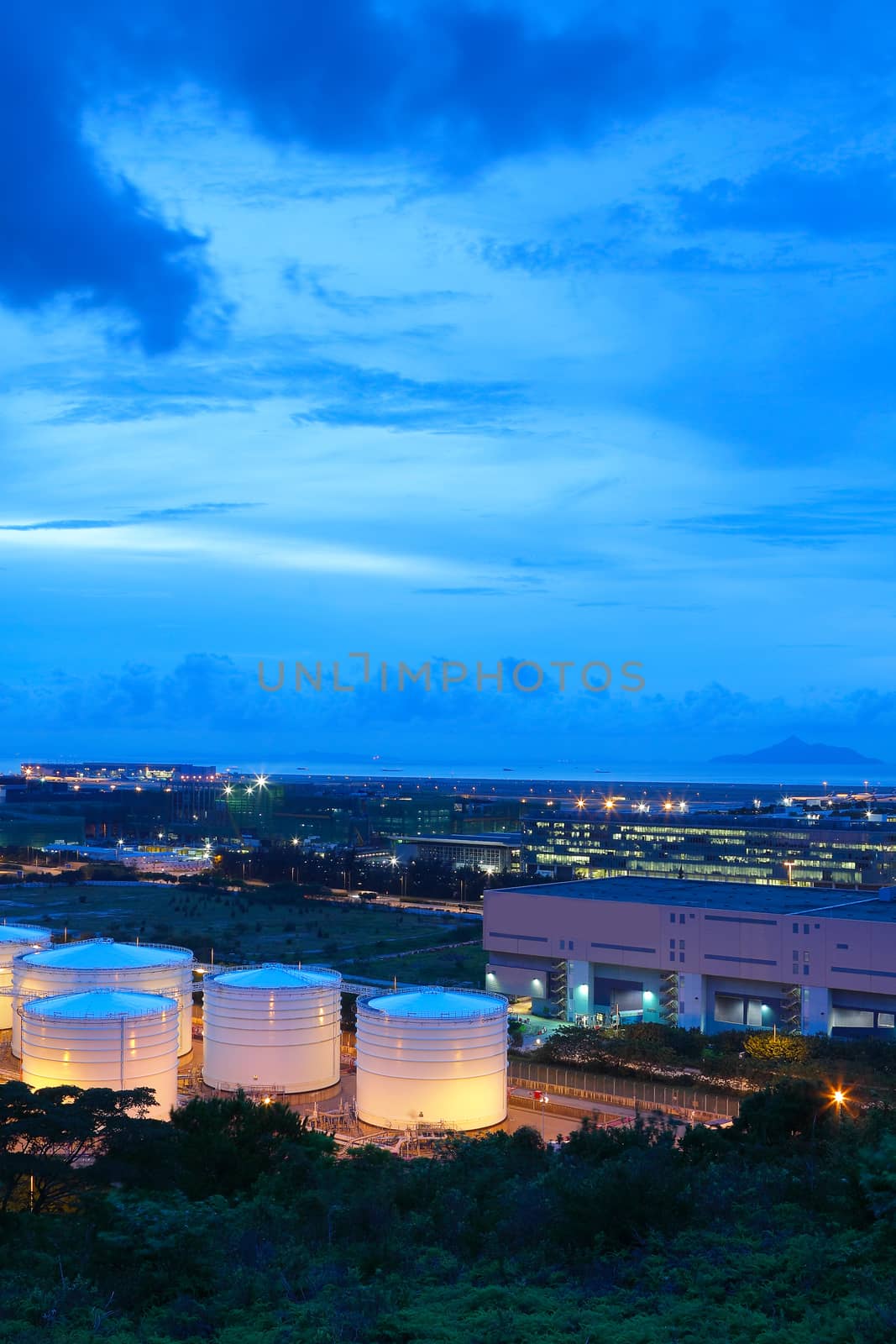 oil tank at night by cozyta