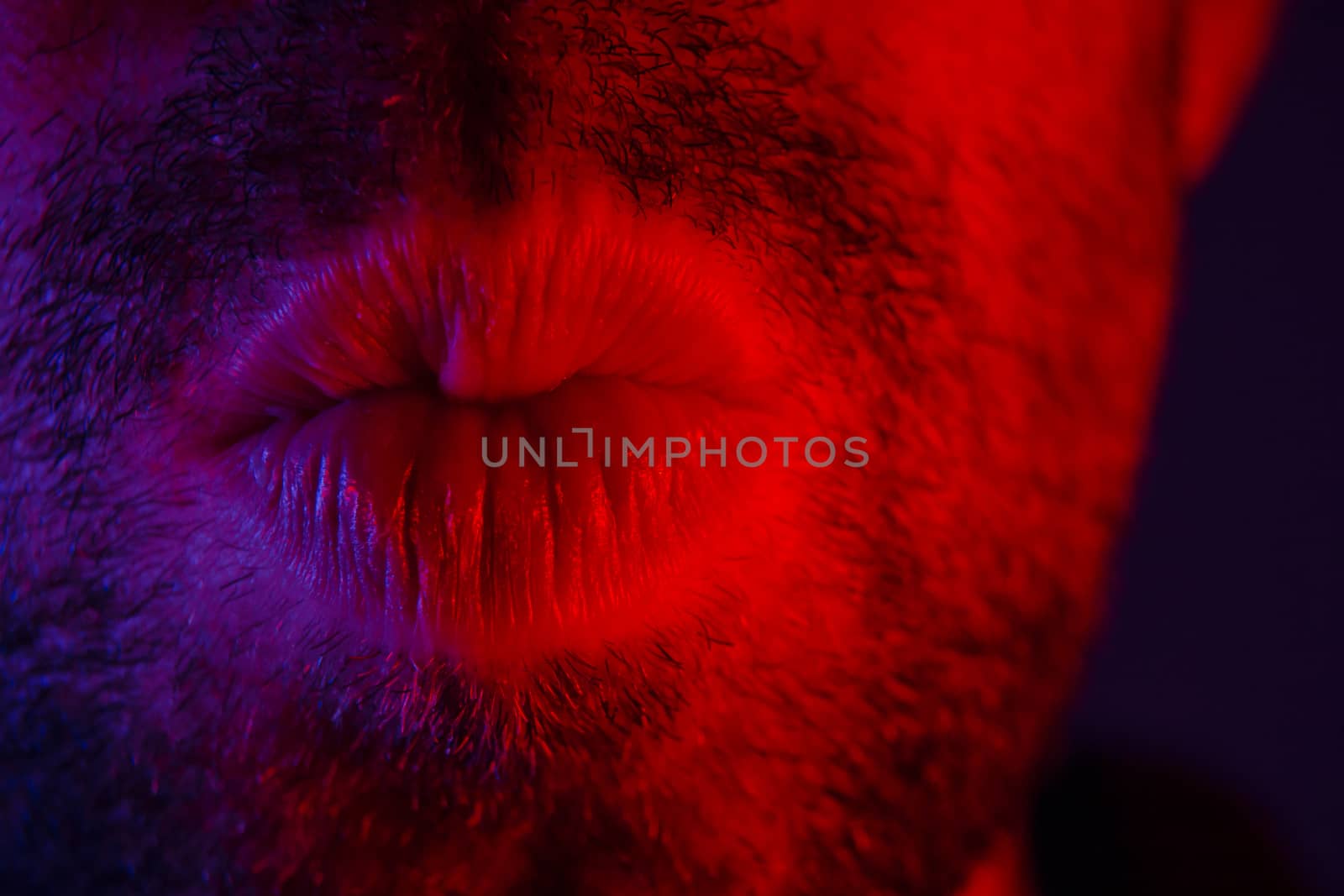 Macro close up on man with seductive facial expression pulled hi by wavemovies
