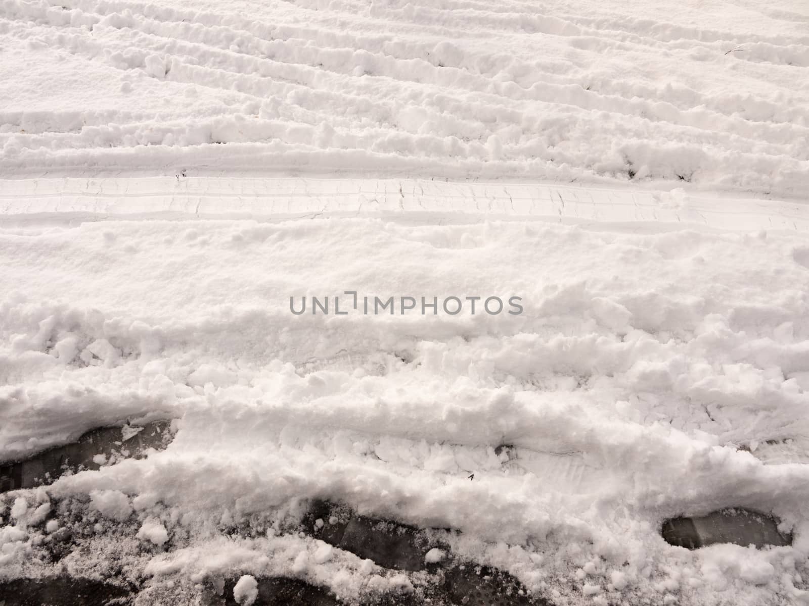 surface full view of snow on ground with footsteps texture winter; essex; england; uk