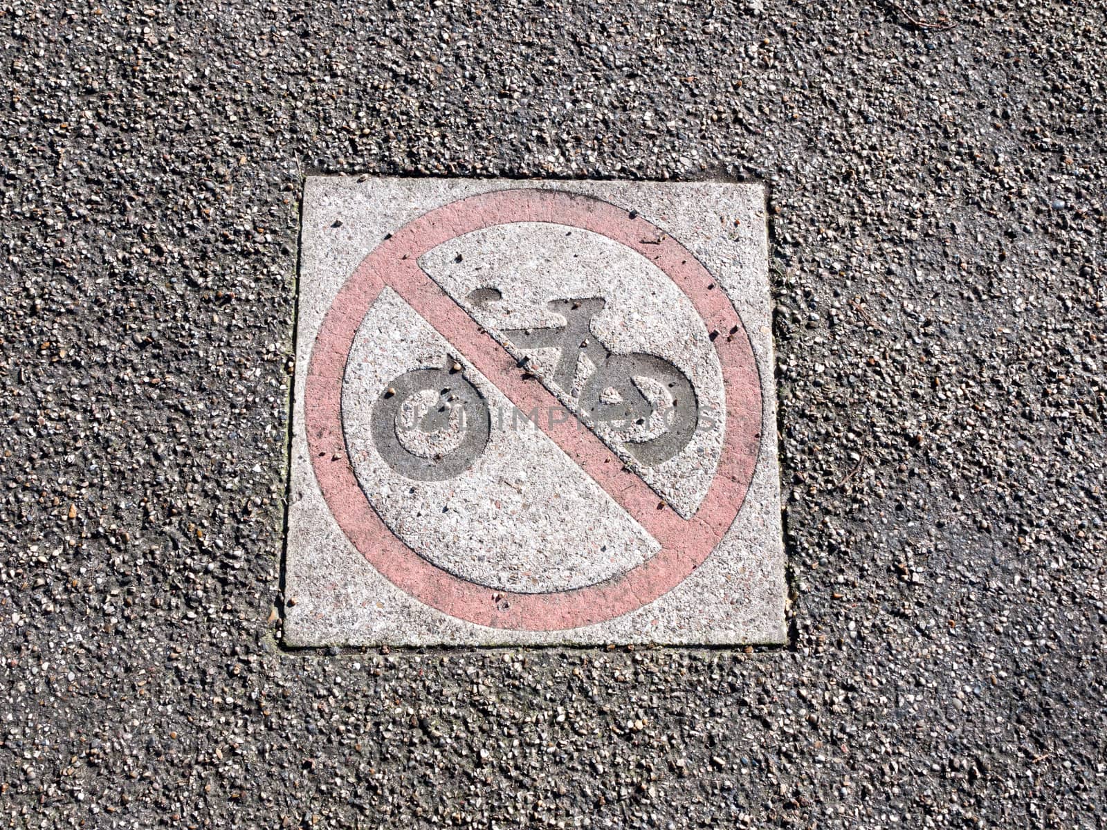 no cycling sign on pavement park floor red circle restriction icon; essex; england; uk