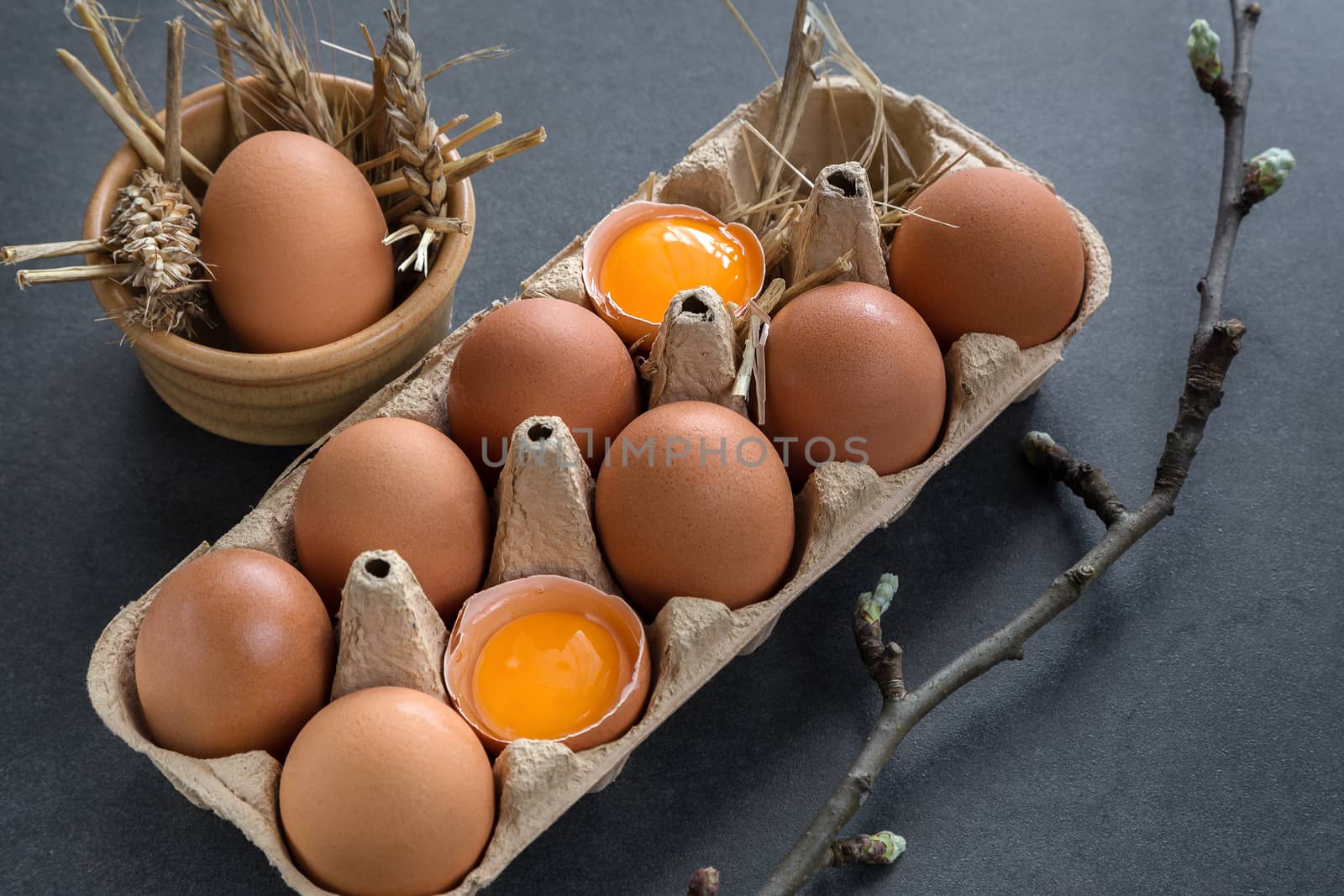 chicken eggs in a cardboard grate on a gray background