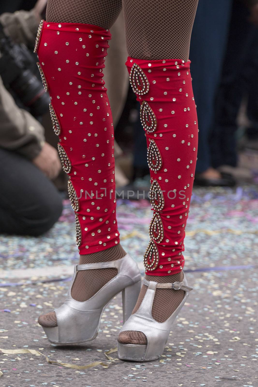 Legs of a colorful Carnival (Carnaval) Parade festival female participant