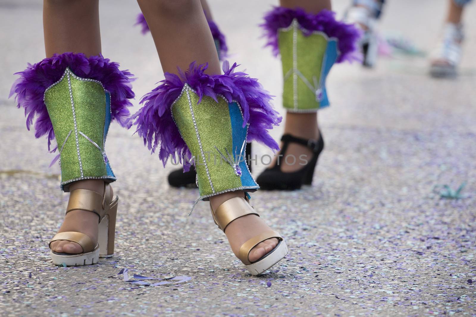 Legs of a colorful Carnival (Carnaval) Parade festival female participant