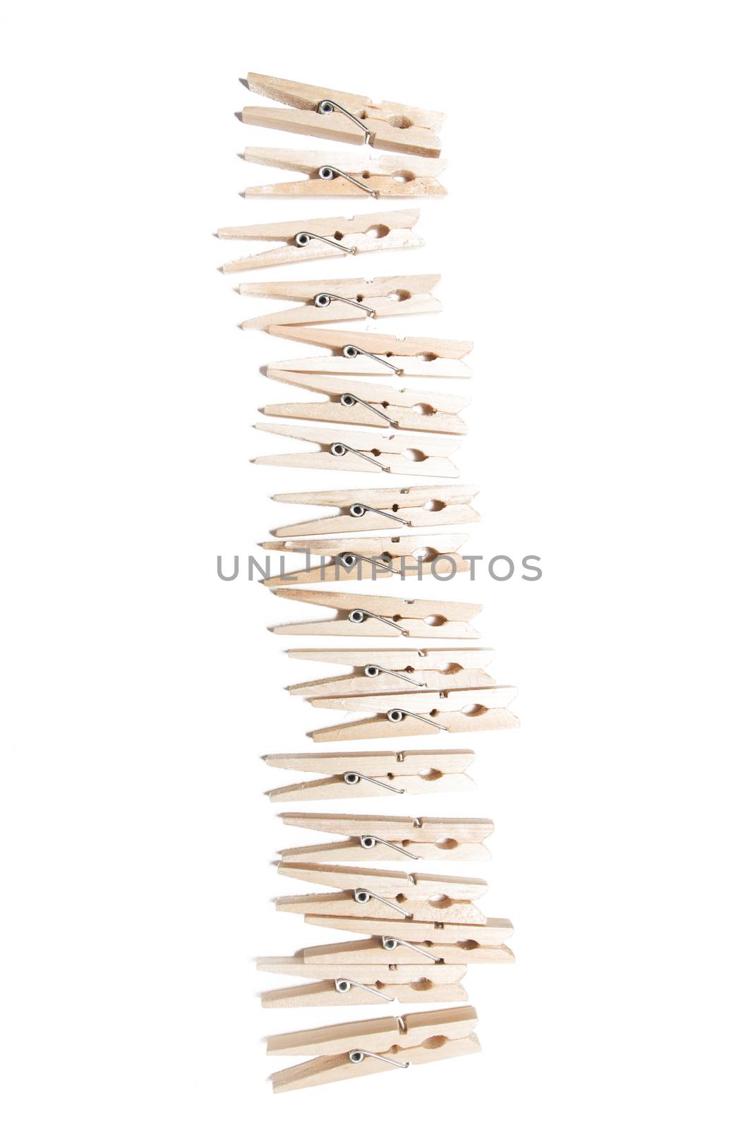 Aligned clothing pegs isolated on a white background.