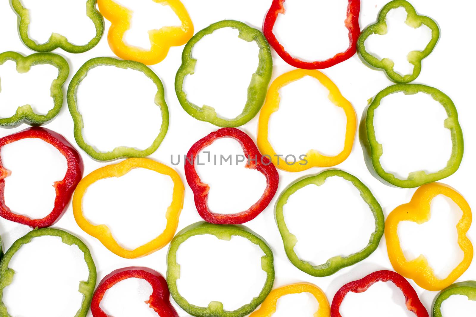 colorful sliced bell peppers isolated on a white background.