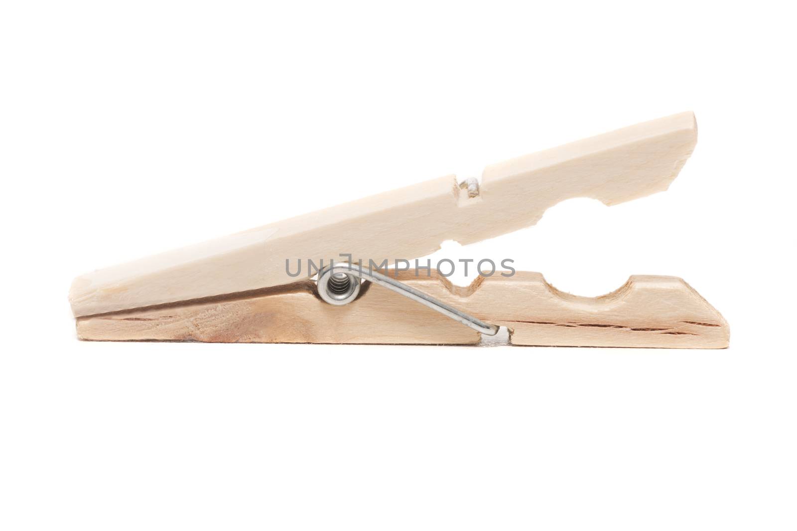 One wooden clothing peg isolated on a white background.