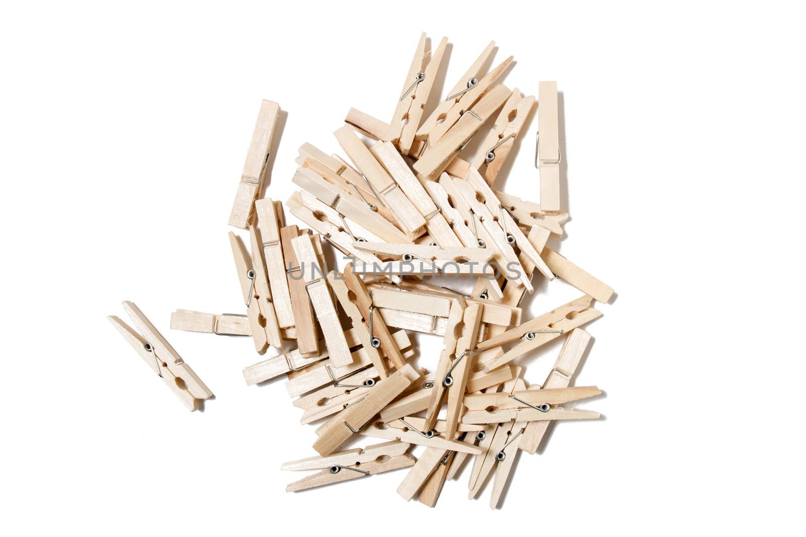 Pile of clothing pegs isolated on a white background.