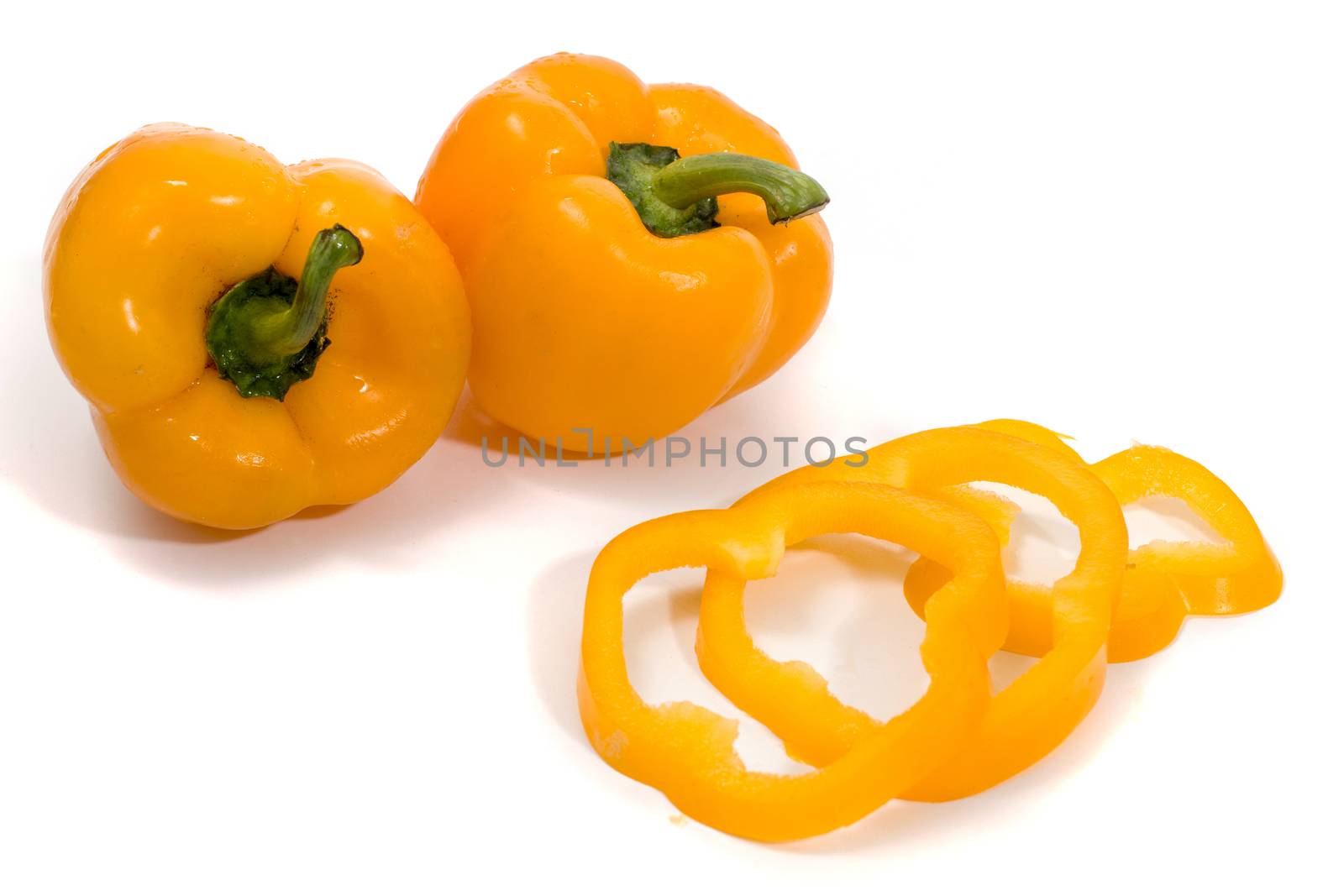 yellow bell peppers isolated on a white background.