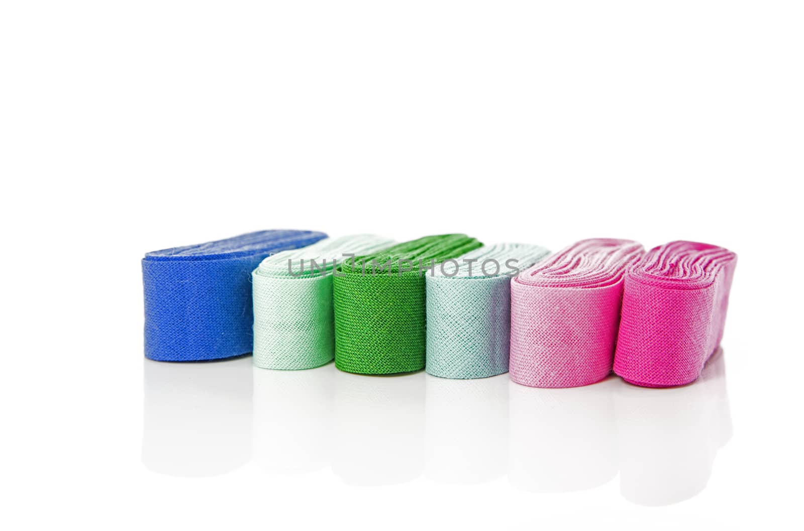bias binding in blue green and purple isolated on white with text space