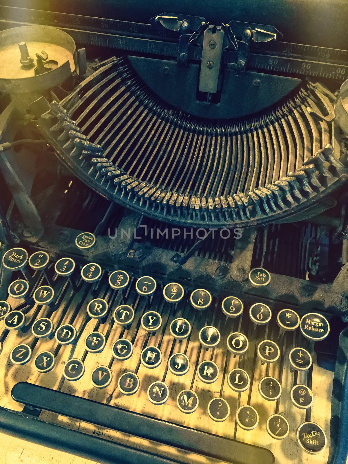 Keys of a vintage typewriter. Retro style photo with light leaks.