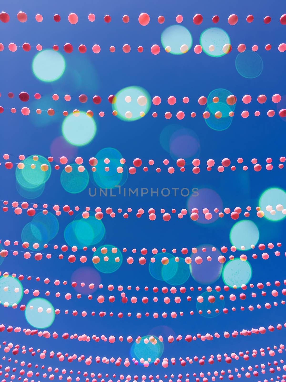 Blue sky background with balloon decorations and bokeh lights by anikasalsera