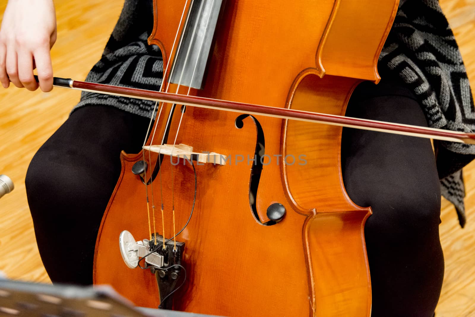 young woman plays cello