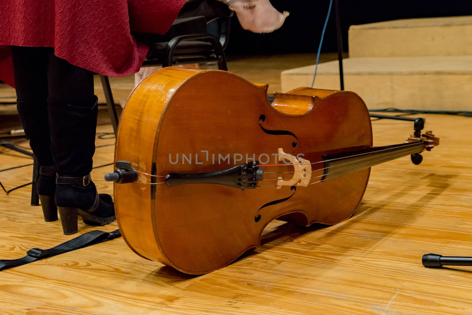 one cello on the floor before concert begins