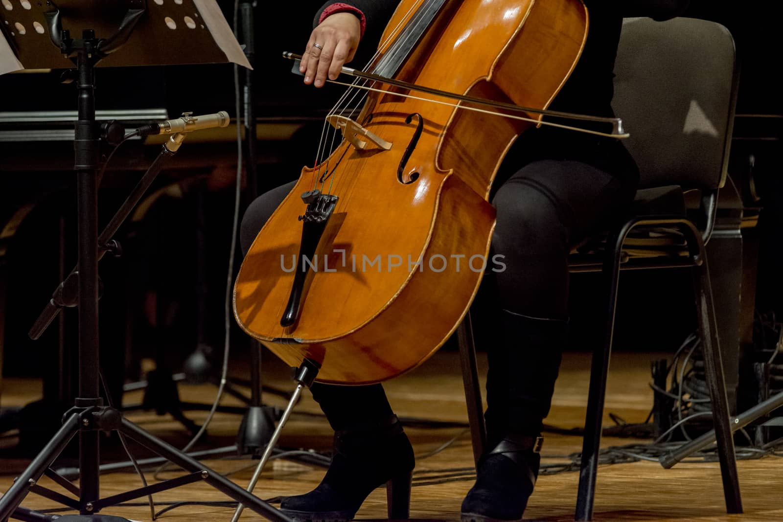 young woman plays cello