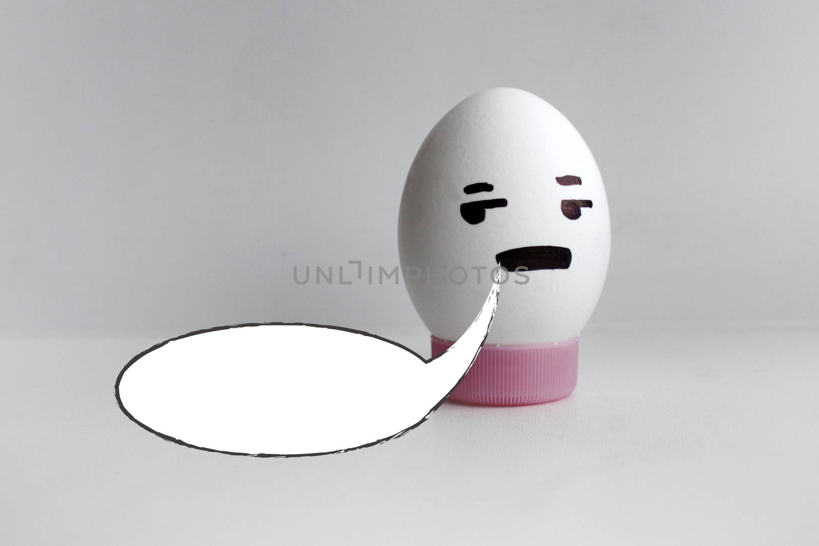 White cloud of thought is empty. Place under the text. Egg cheerful with face alone on white background concept of gossip. Photo for your design
