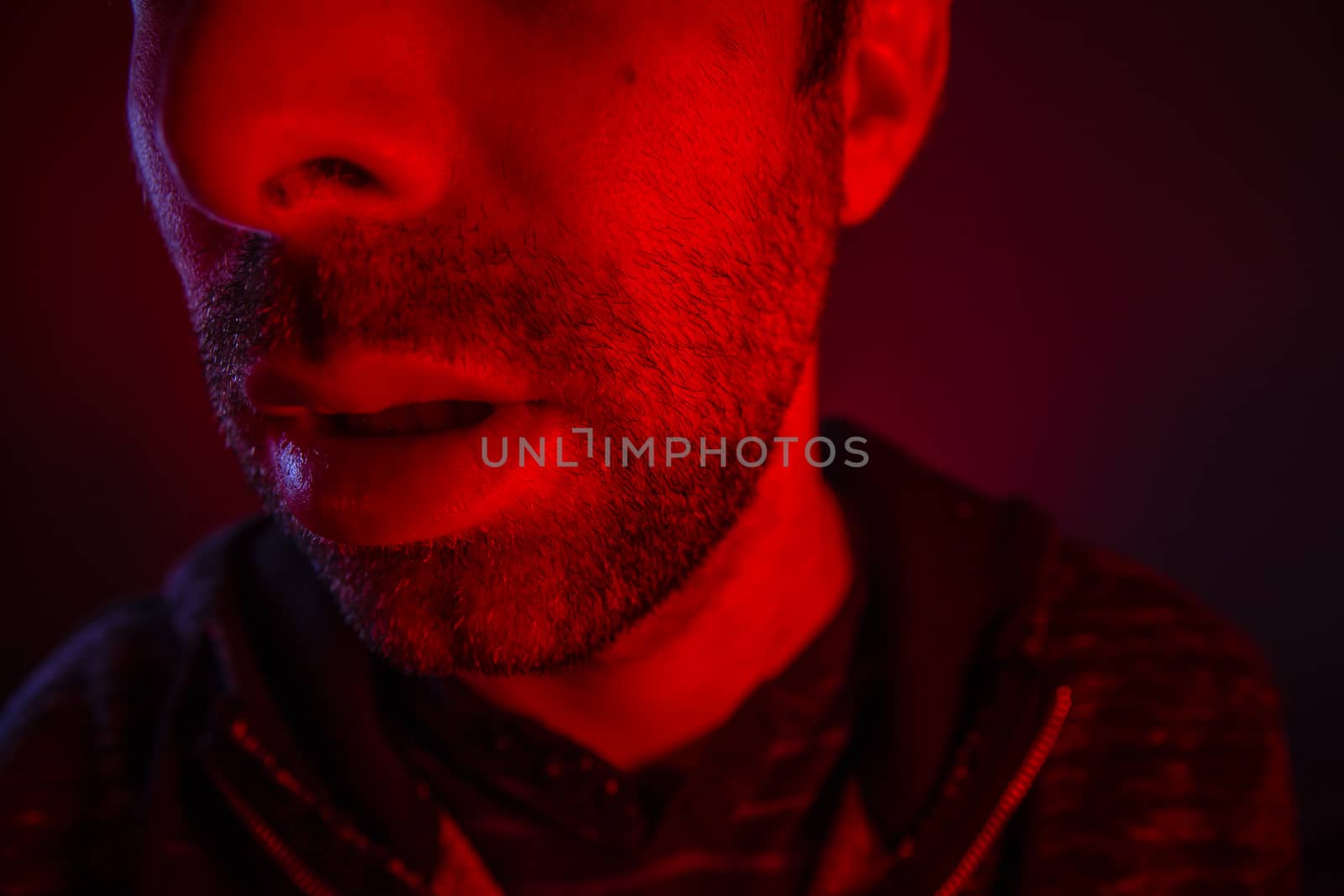 Close up on man open mouth with serious facial expression by wavemovies