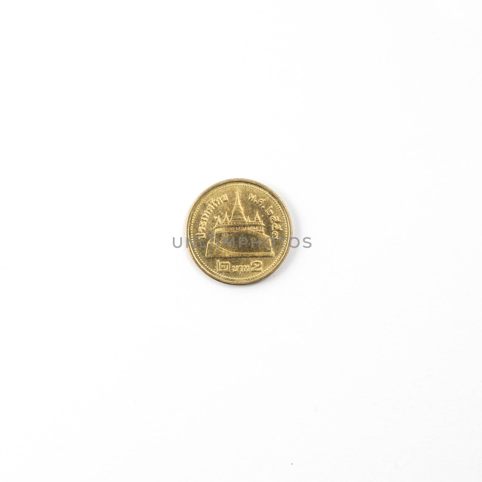 Thai coin from 2 Bath on a white surface