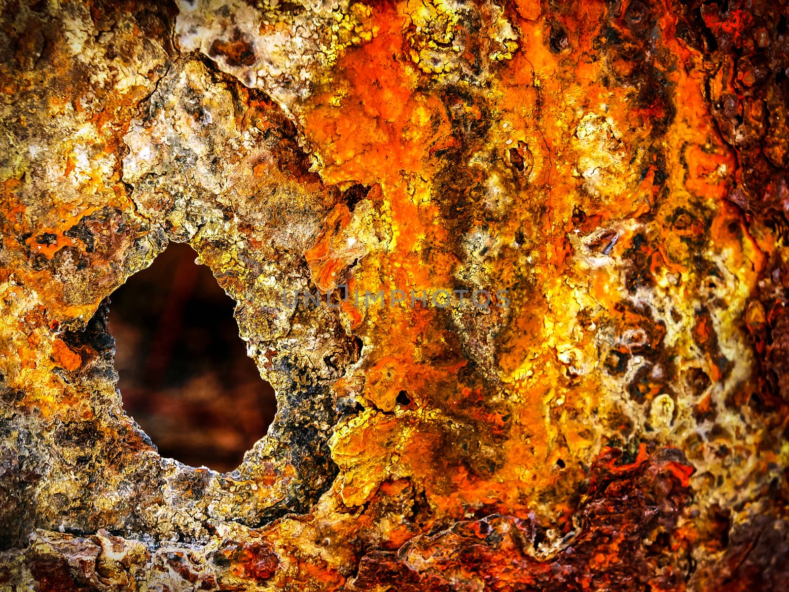 Red and yellow of grungy rust on raw steel background