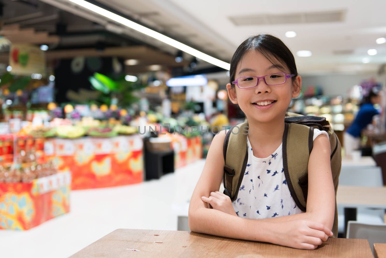 Portrait of Asian girl in supermarket by Kenishirotie