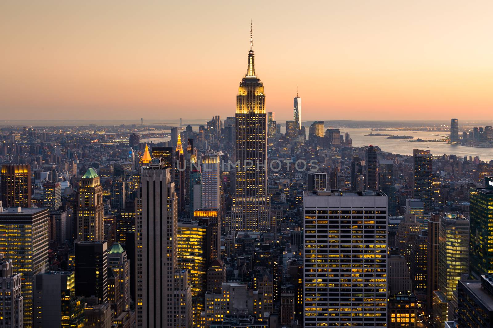 Golden sunset panoramic view of building and skyscrapers in Midtown and downtown skyline of lower Manhattan, New York City, USA.