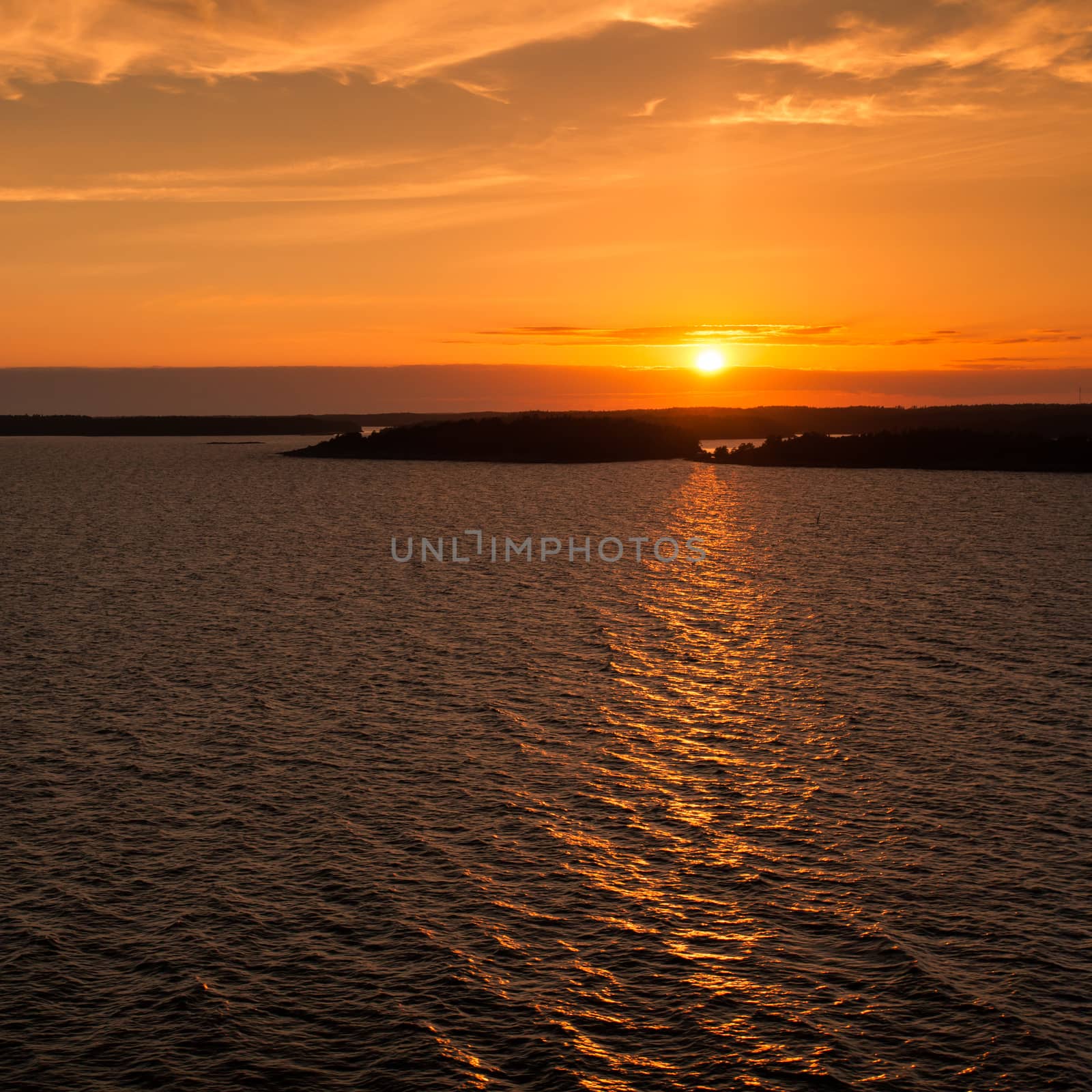 A sunset image on the Baltic Sea taken from the deck of a cruise ship.