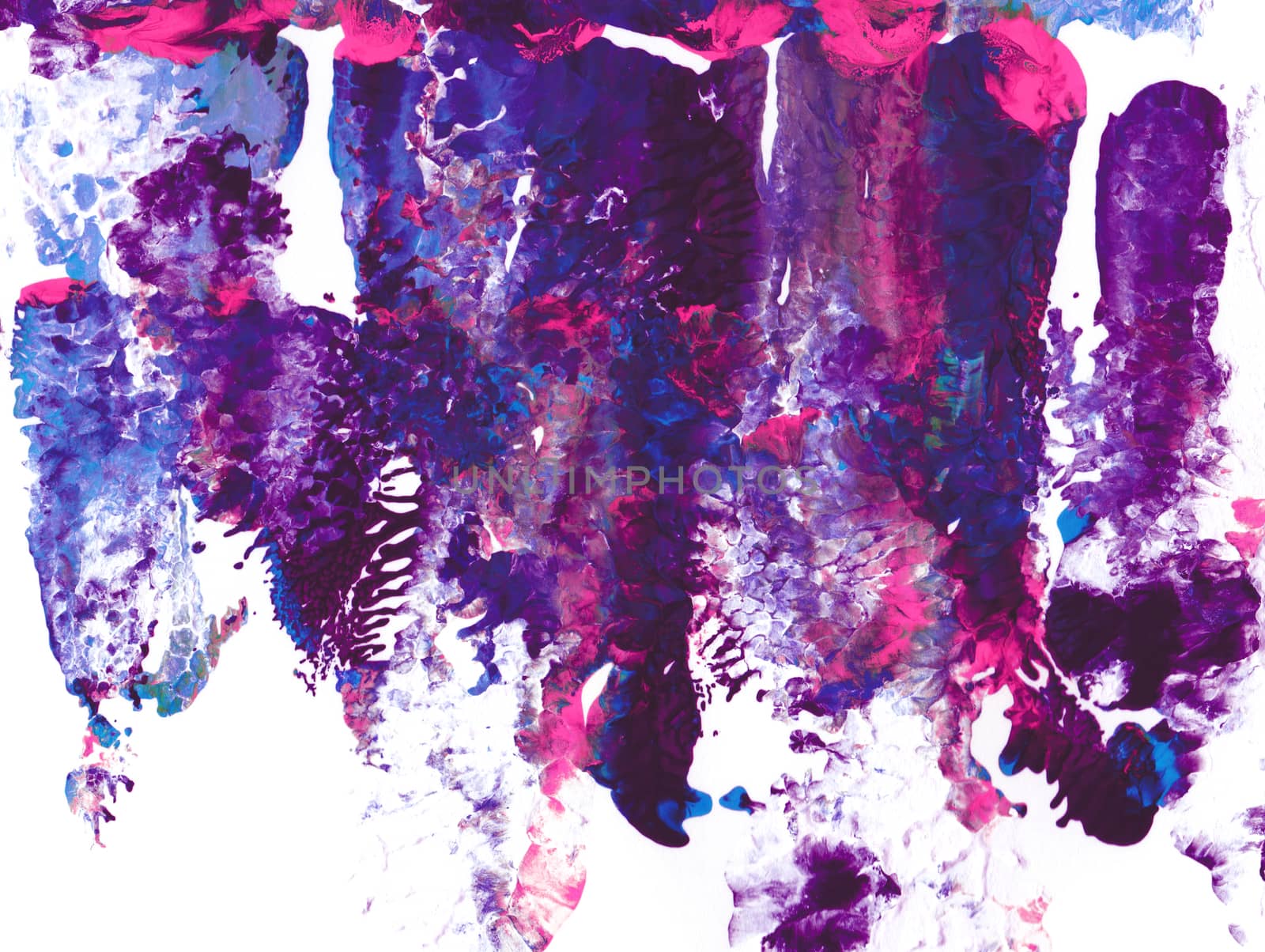 Purple and pink acrylic paint in abstract smears on white paper background