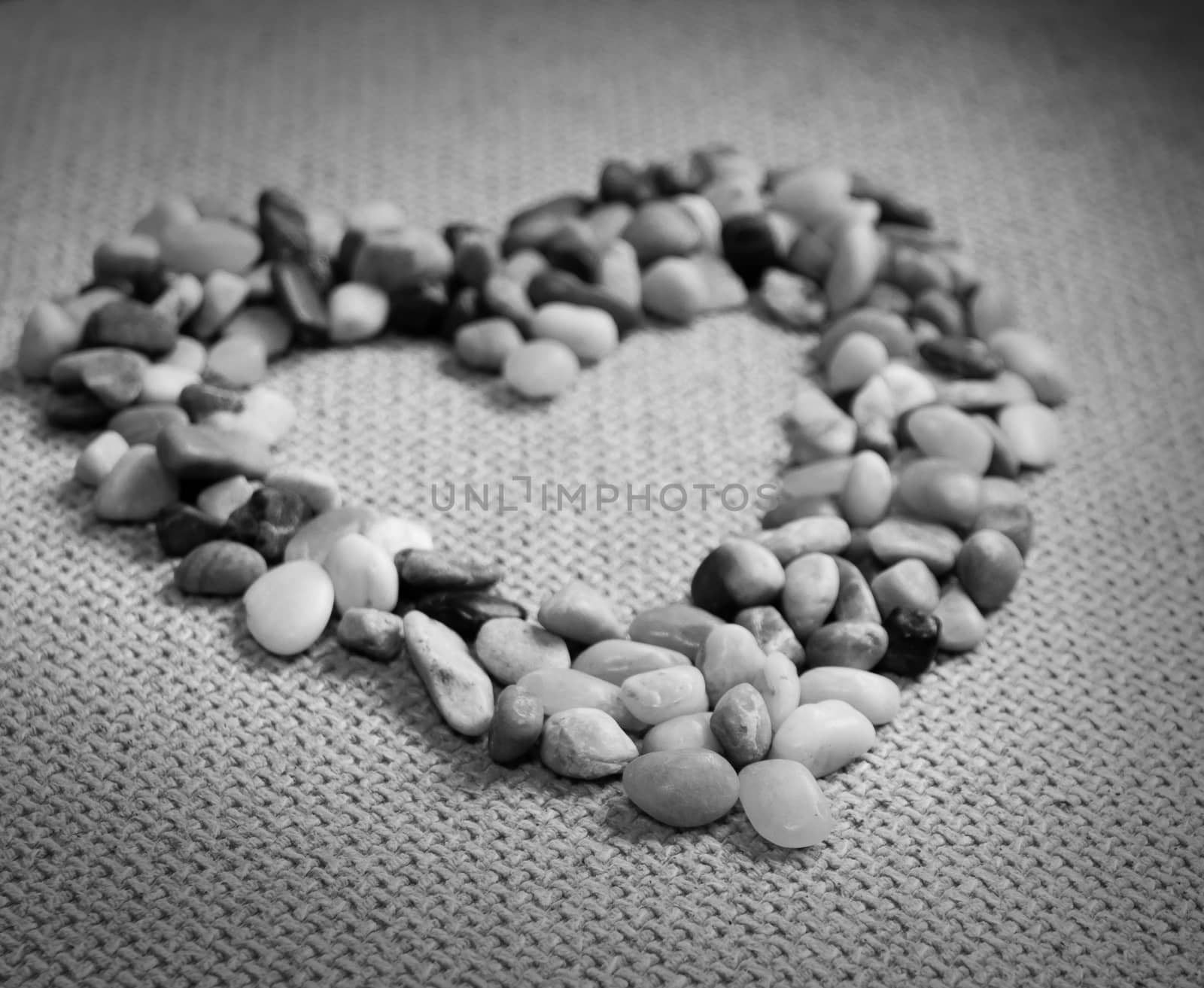 Small stones in the heart shape. The picture is black and white.