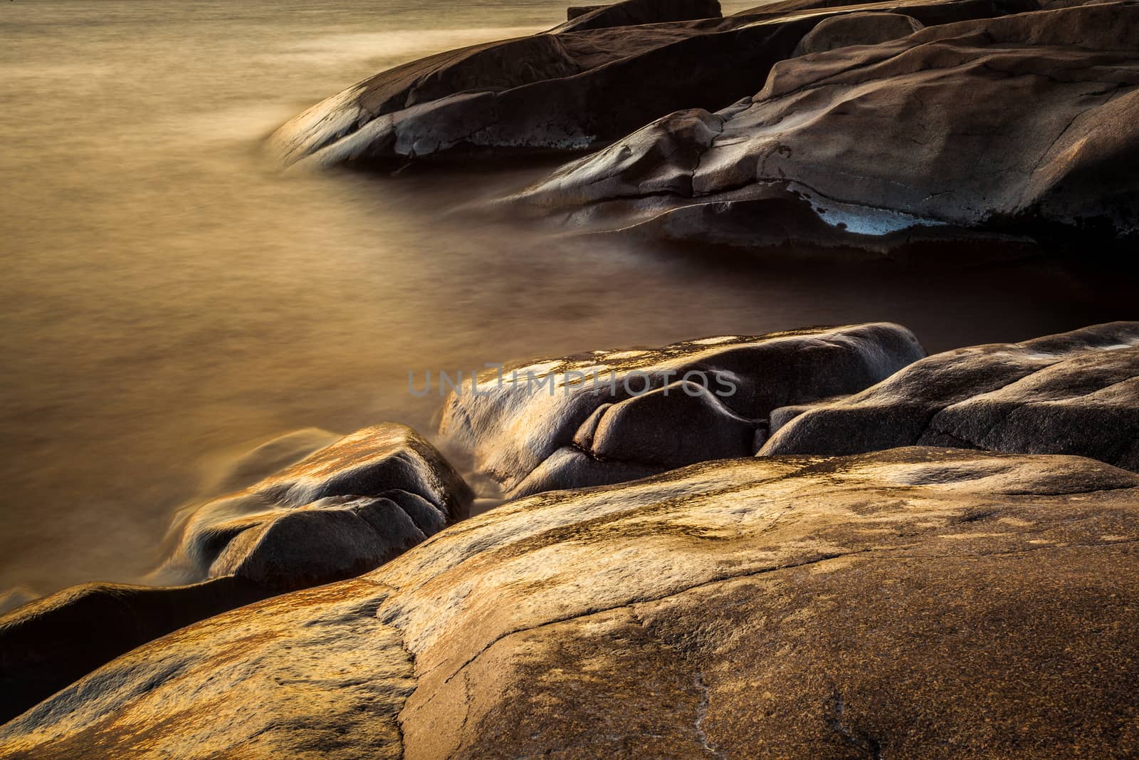 Golden hour on rocks, taken in Pori, Finland
