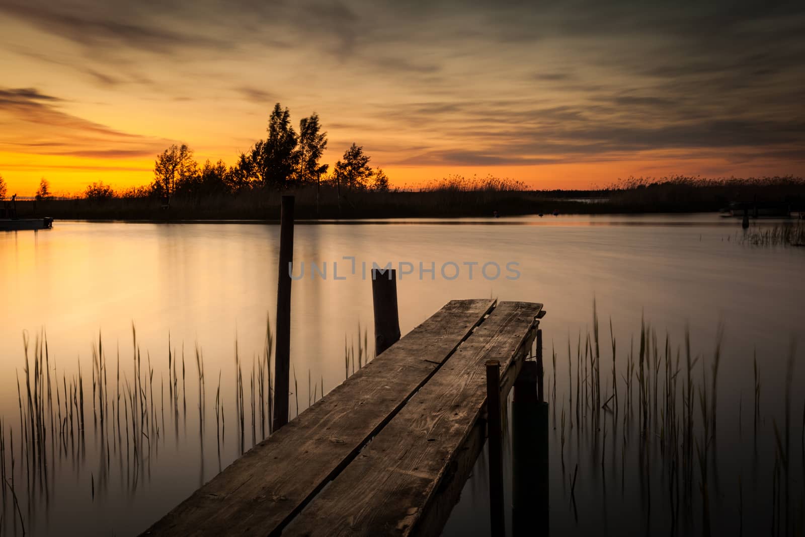 Beautiful sunset picture. The picture also has a dock.