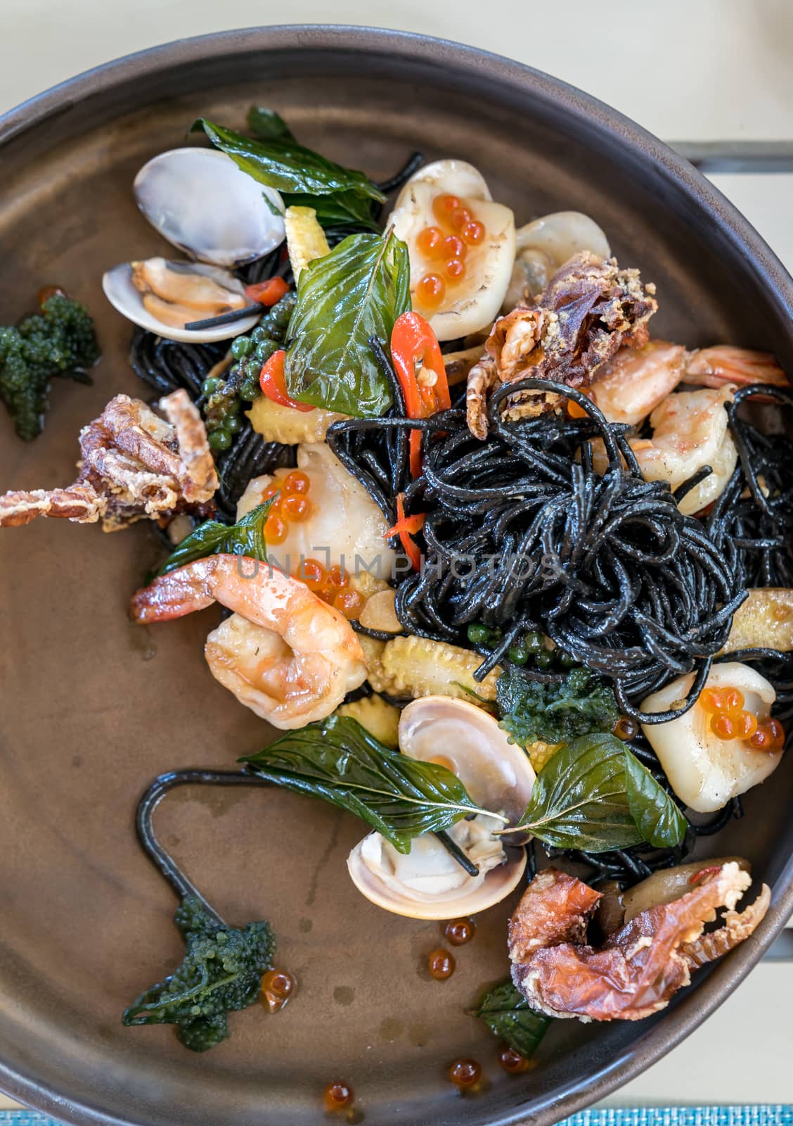 The Mediterranean delicacy food. Black seafood pasta spaghetti  with mussels calm shrimp and crab