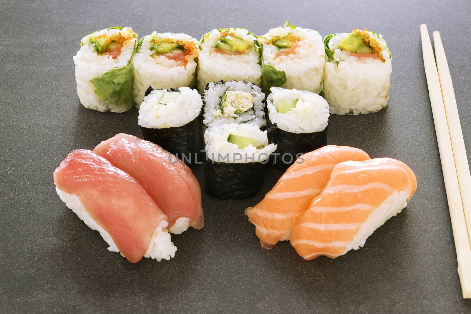 Plate of sushi rolls by ventdusud