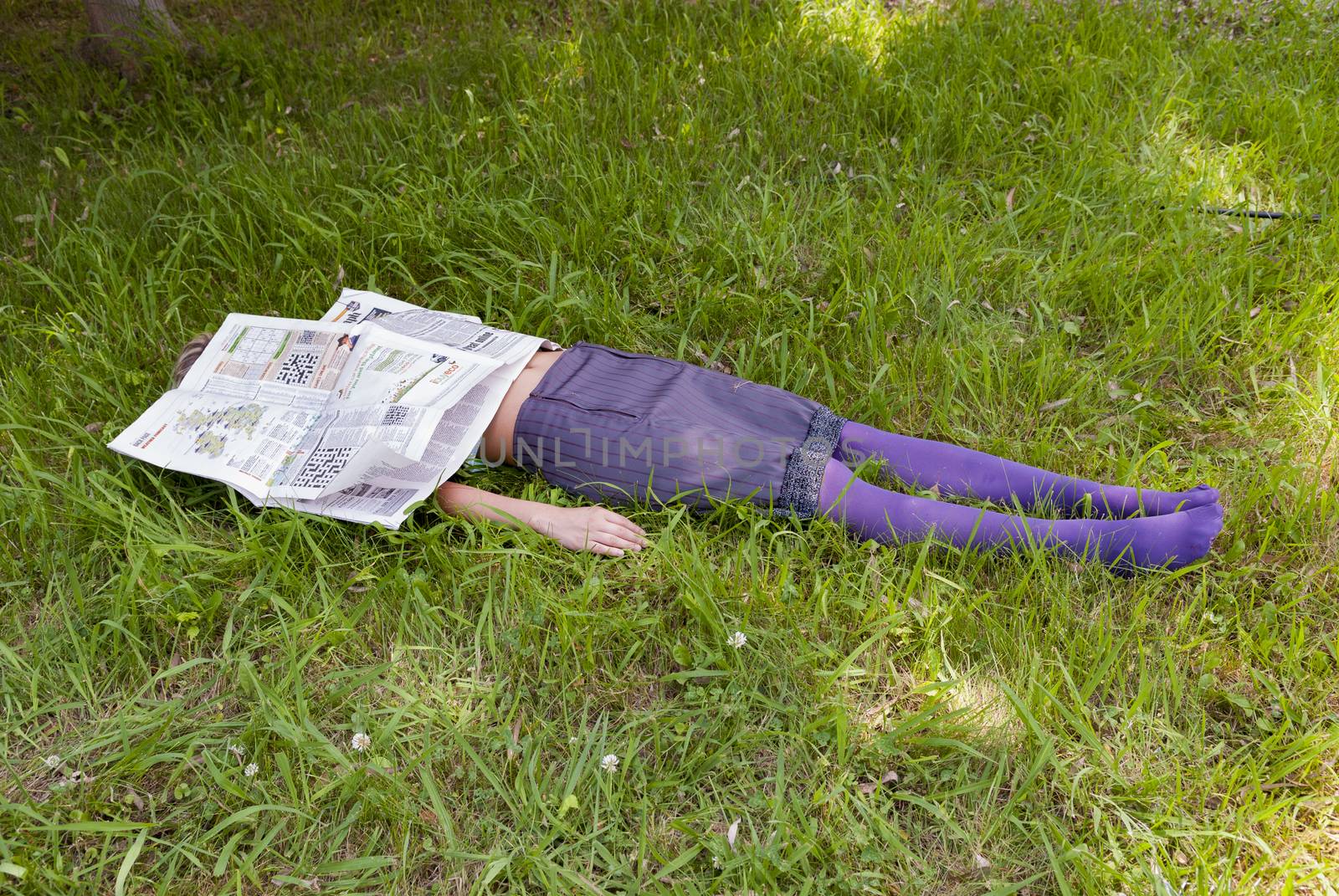 young woman lying on the grass by vangelis