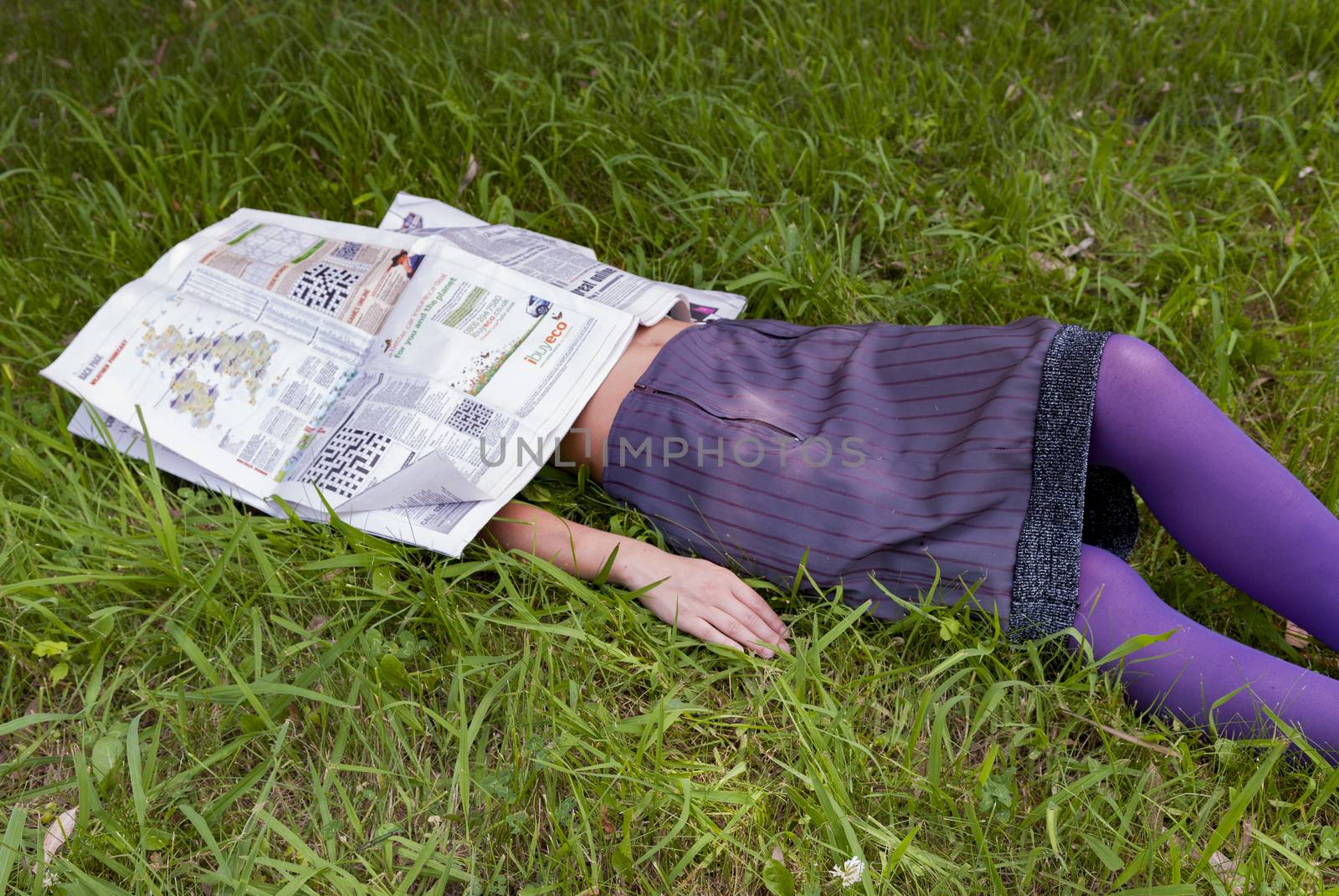 young woman lying on the grass by vangelis