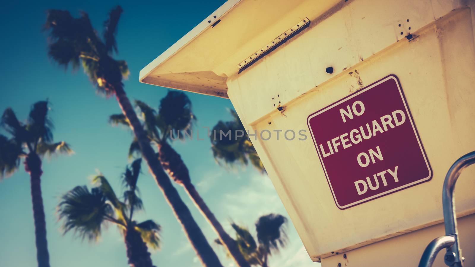 Retro Image Of A Lifeguard Station Or Tower On A Beach In California With Palm Trees