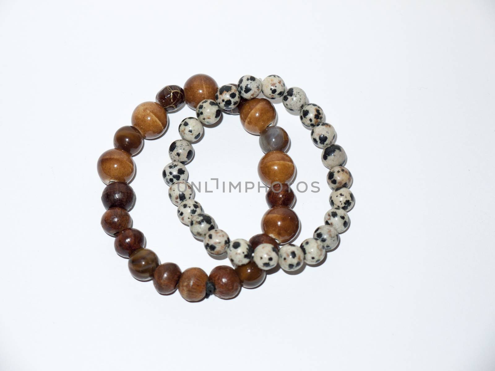 two bead bracelets white background studio small fancy unique; essex; england; uk