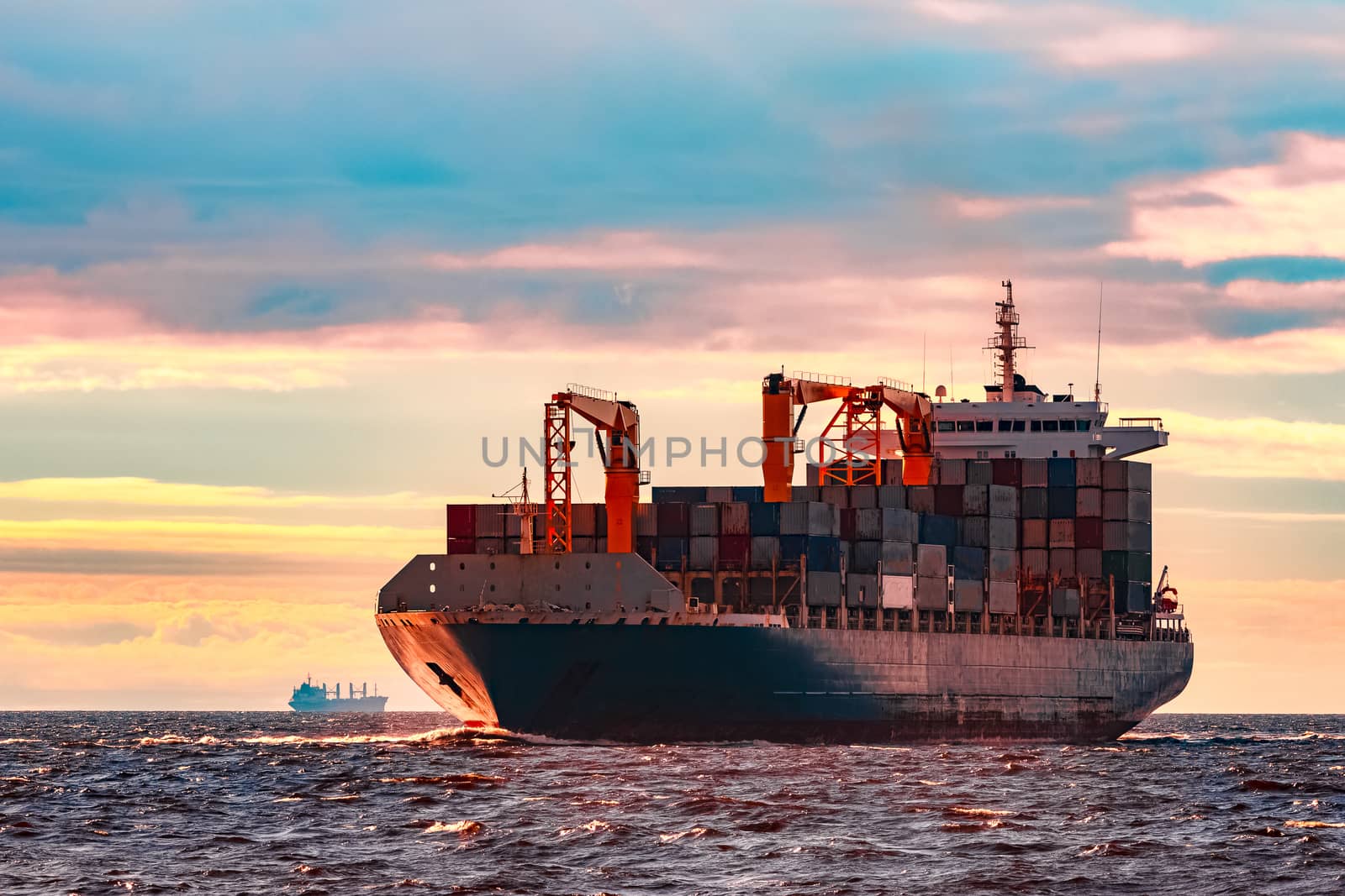 Blue container ship. World logistics and production transfer