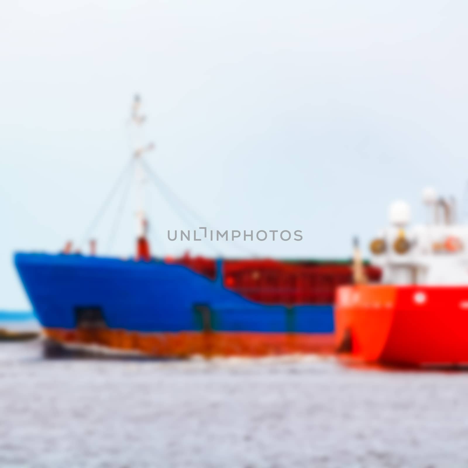 Blue cargo ship - blurred image by sengnsp