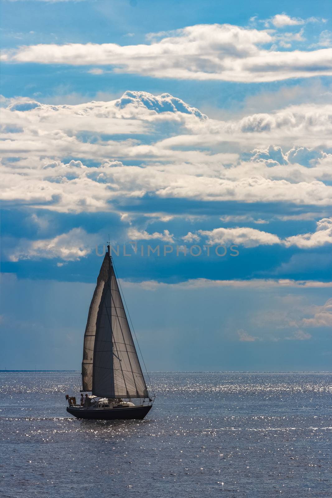 Blue sailboat in travel by Europe. Sea journey