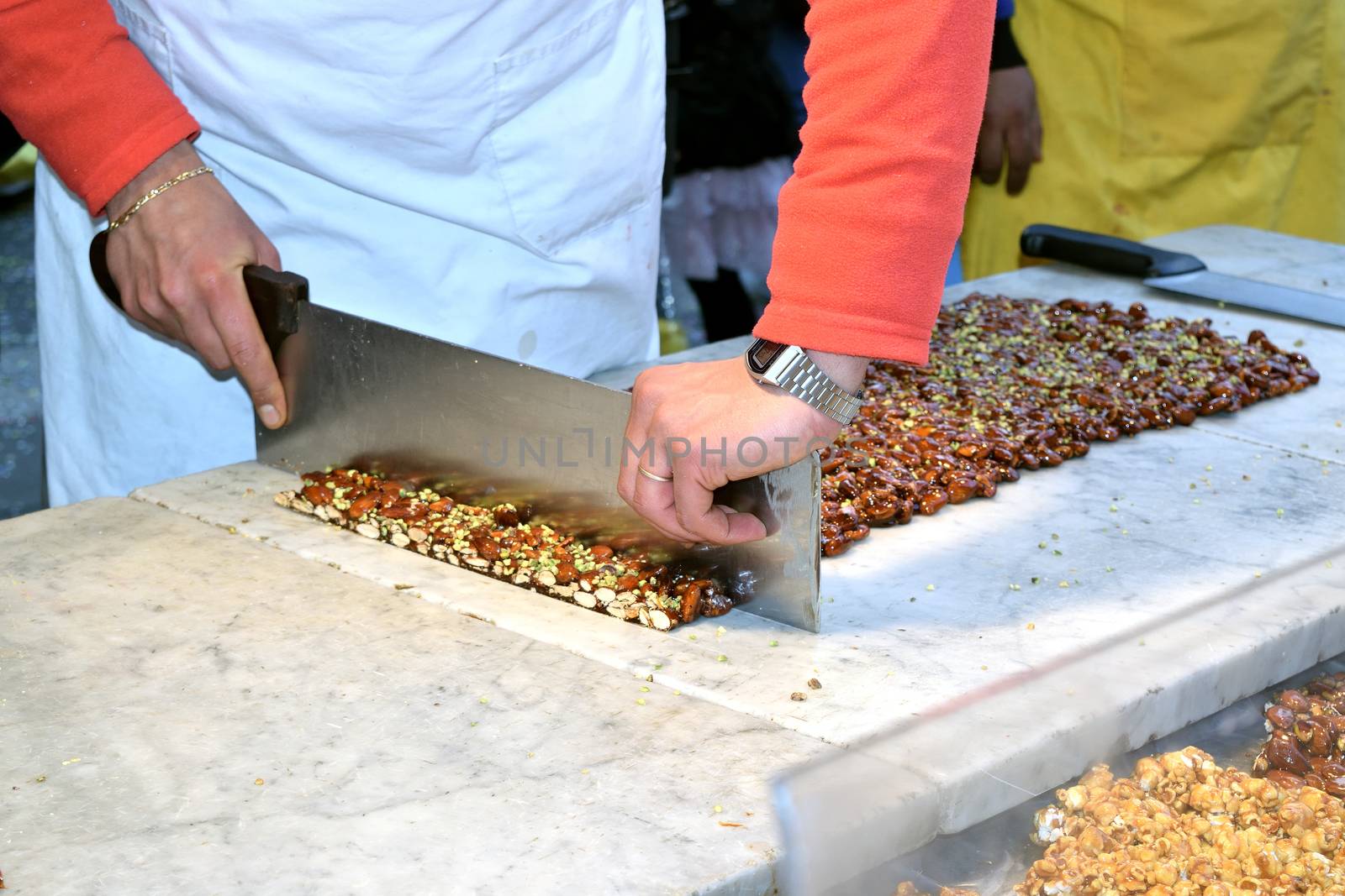 Stall with artisan preparing the traditional Sicilian torrone