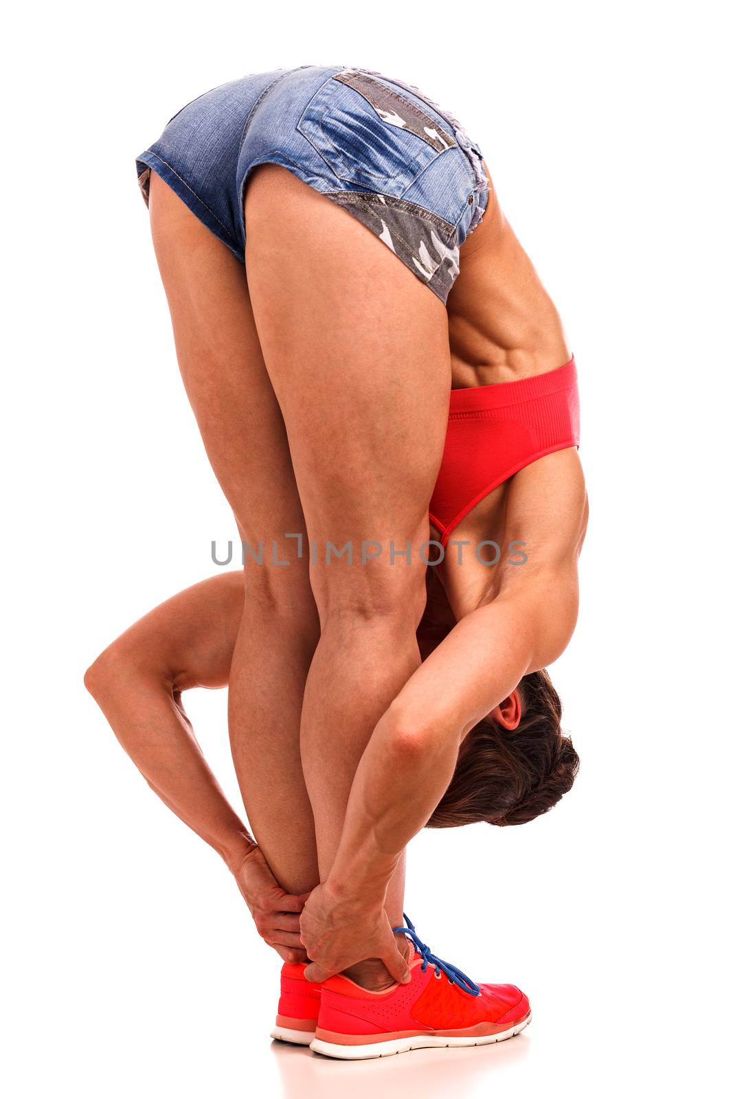 Fitness woman doing stretching, isolated on white background