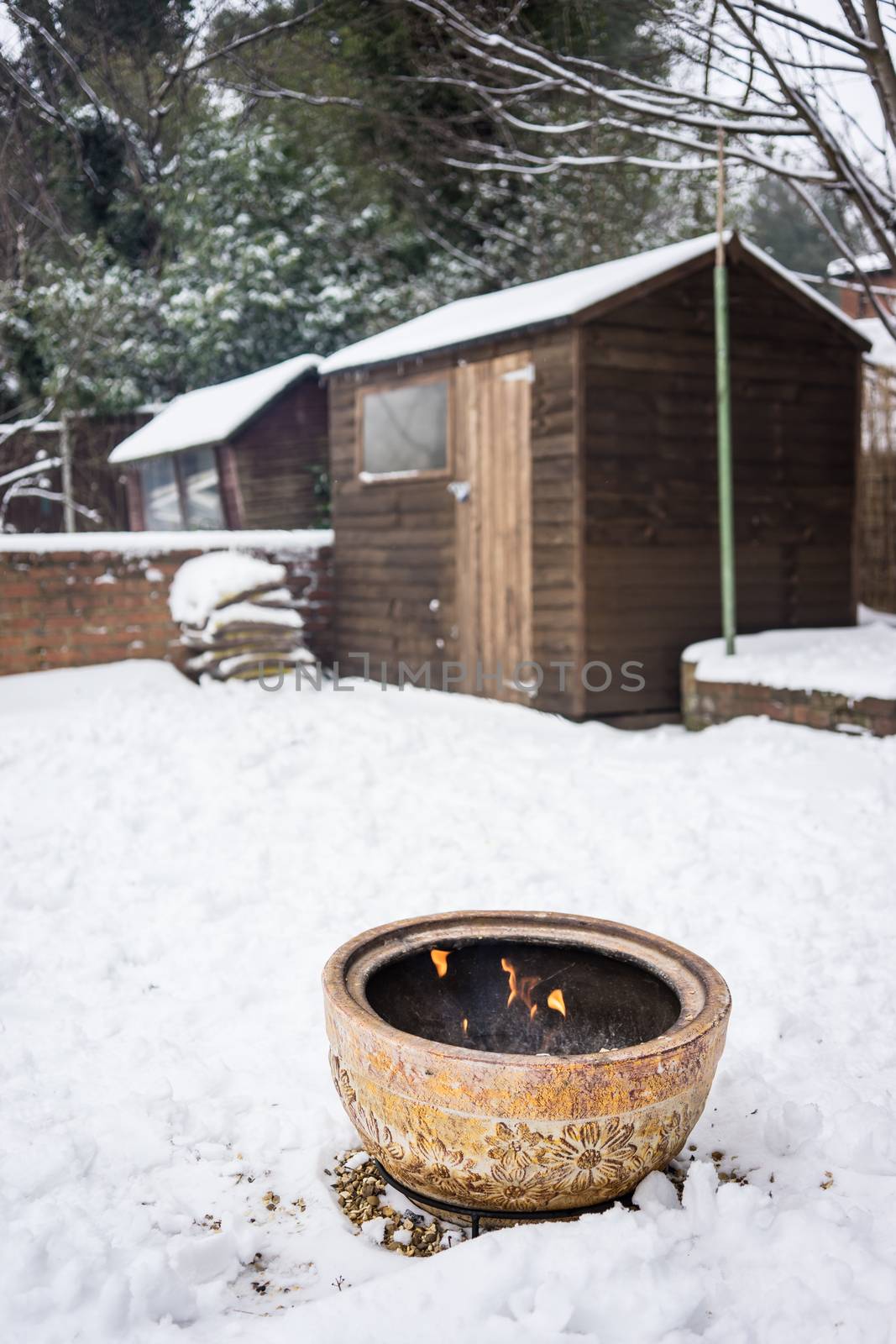 Fire bowl heating in a cold snowy winter.