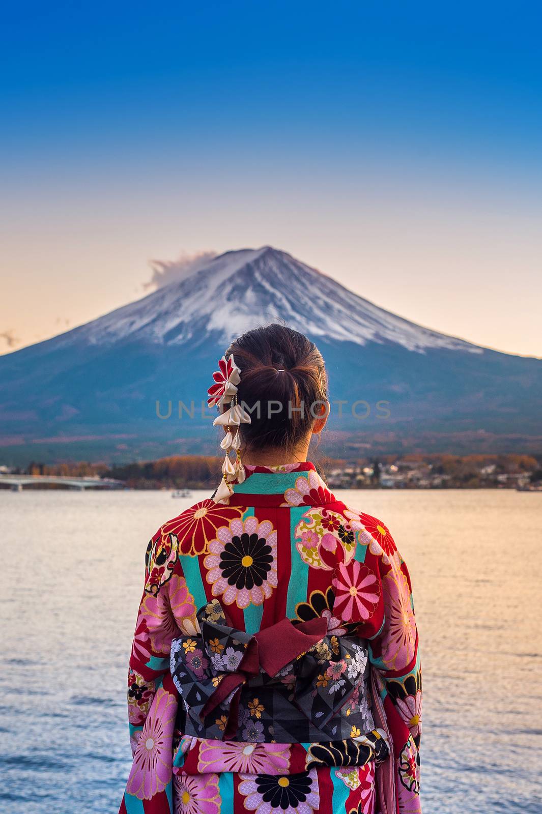 Asian woman wearing japanese traditional kimono at Fuji mountain. Sunset at Kawaguchiko lake in Japan. by gutarphotoghaphy