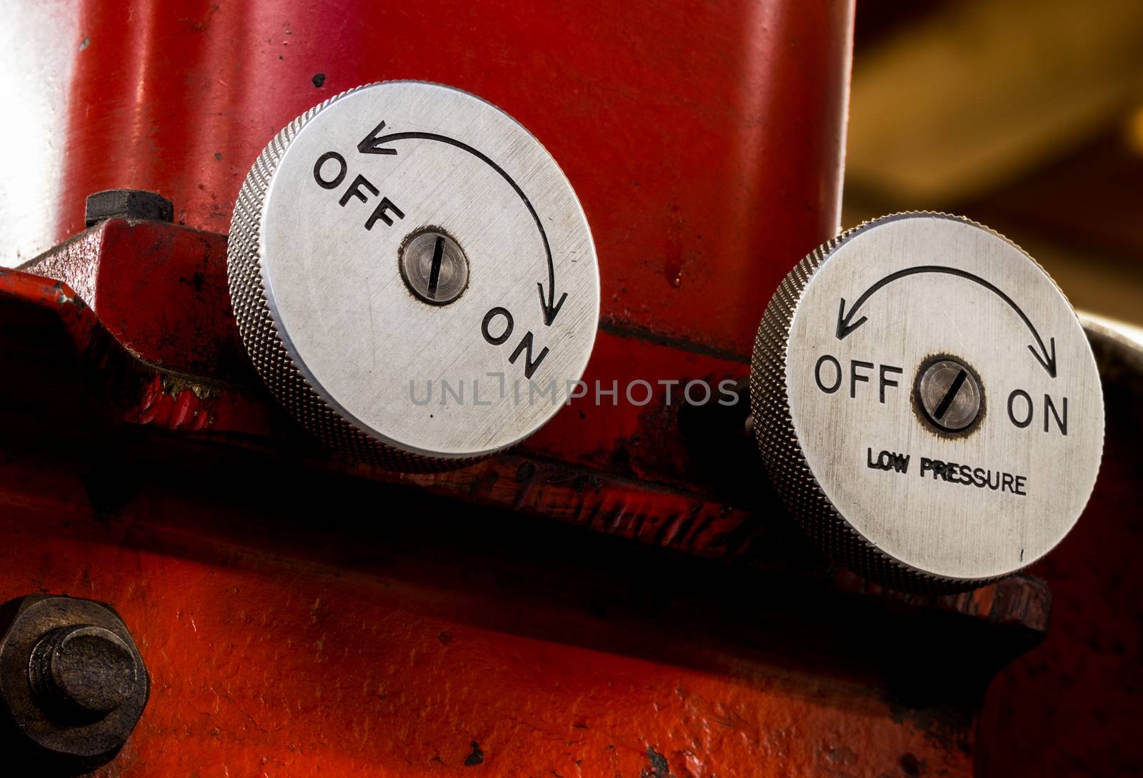 Vintage antique automotive machine shop hydraulic press pressure valve dials on a red press