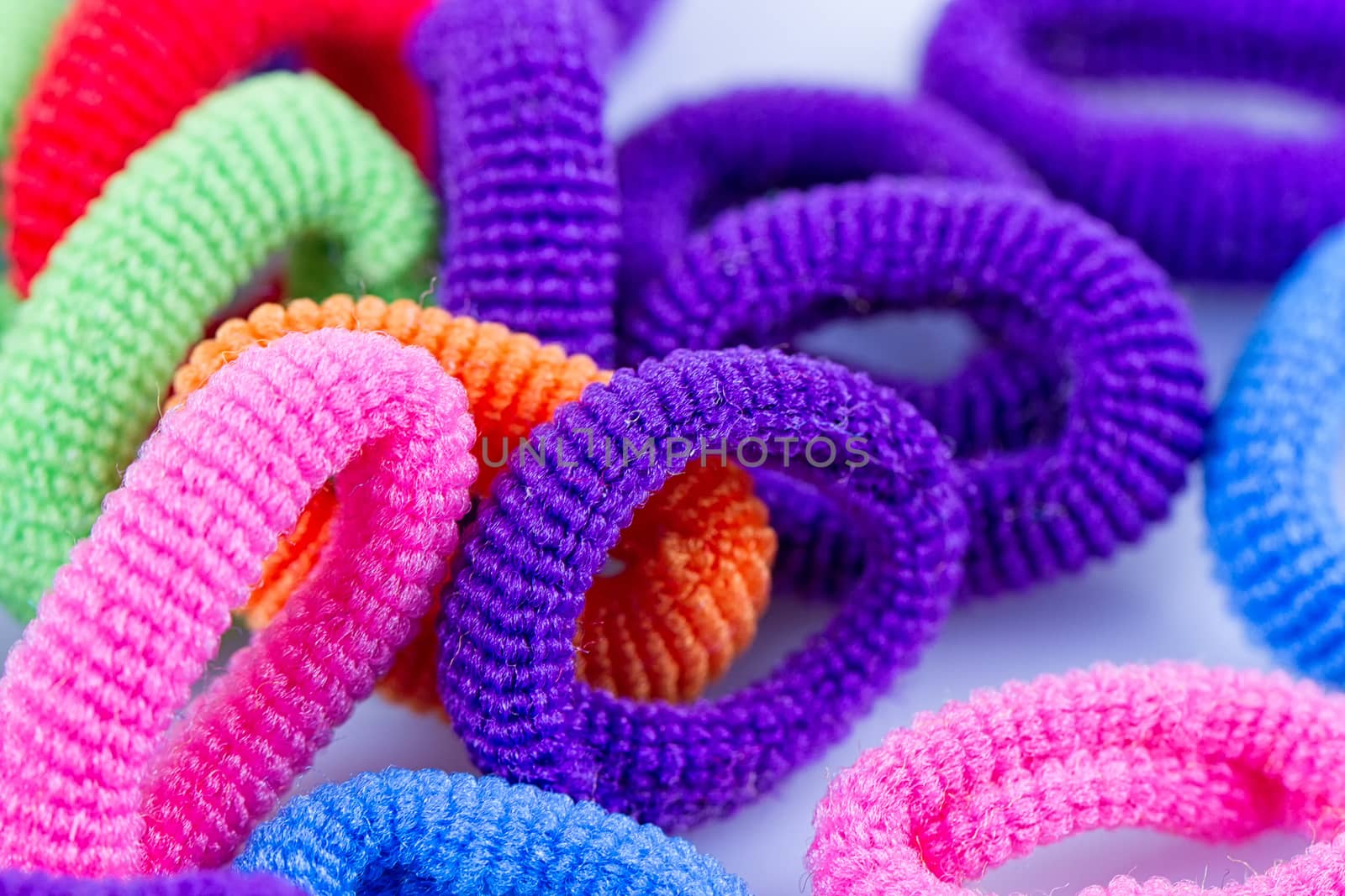 the hair multicolored rubber bands grouped close-up