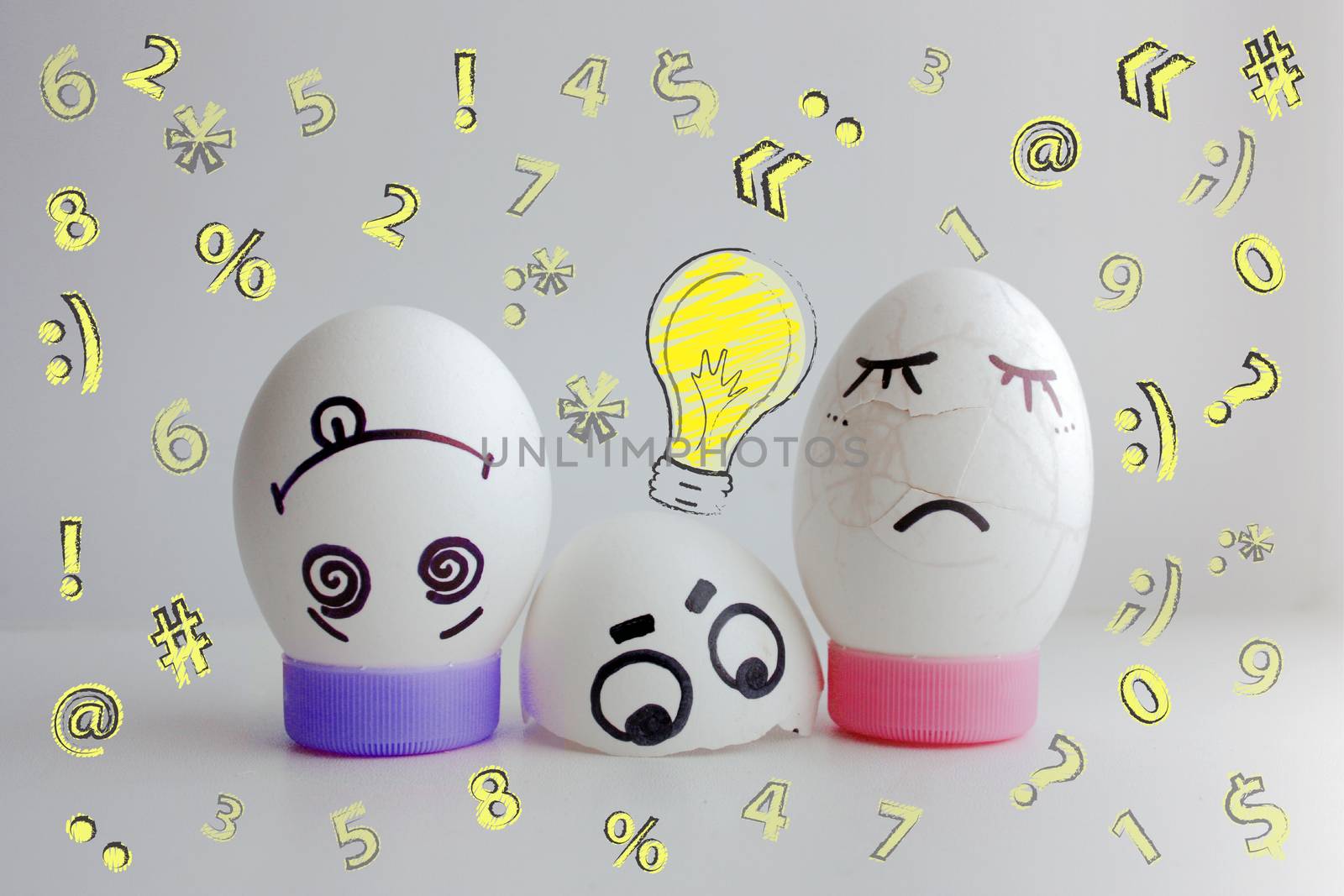 Concept of idea. Light. Eggs cheerful with a face two on a white background on a stand the concept of a jumped out crashed. Photo for your design