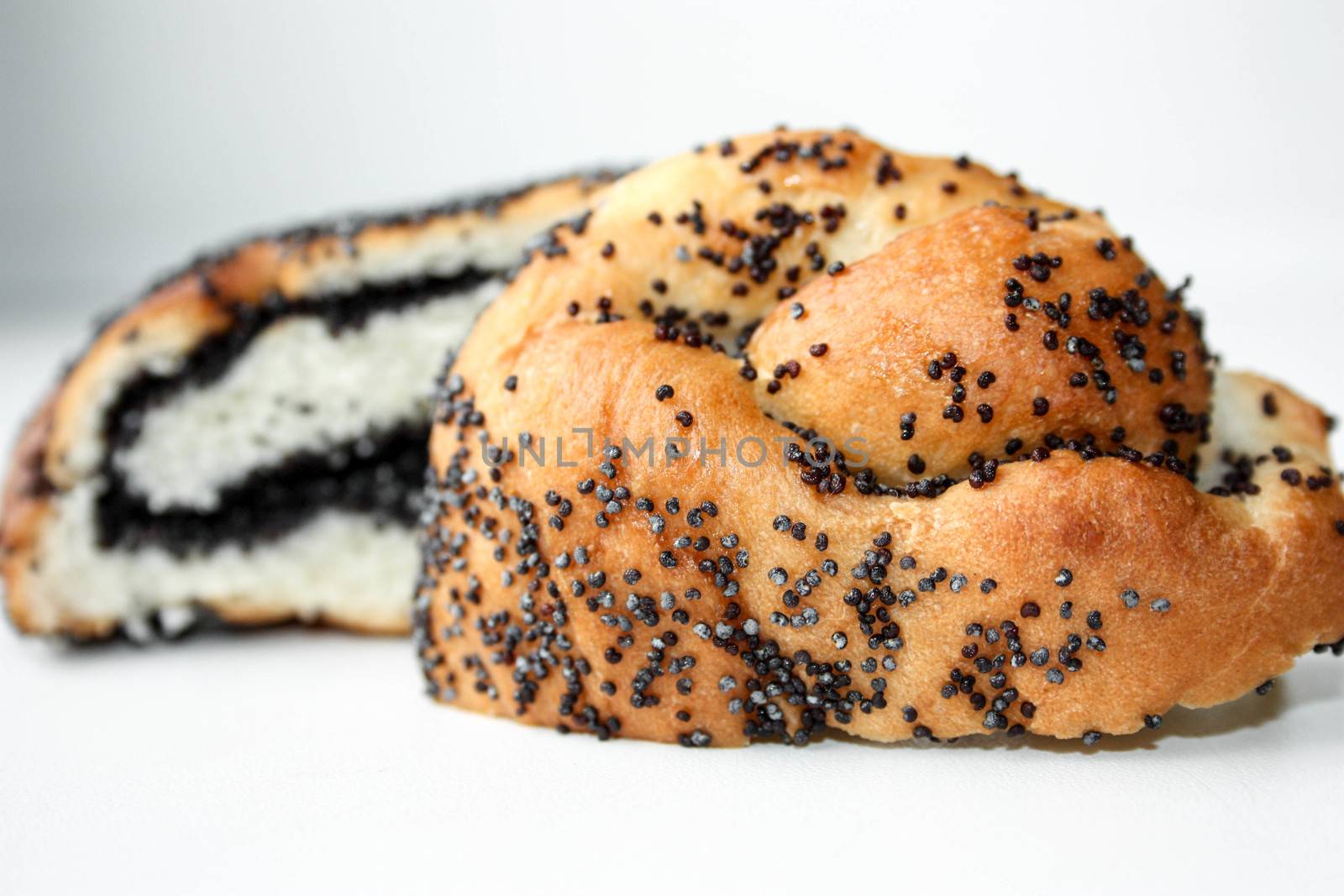 Roll with poppy seeds. Appetizing. Photo for your design.