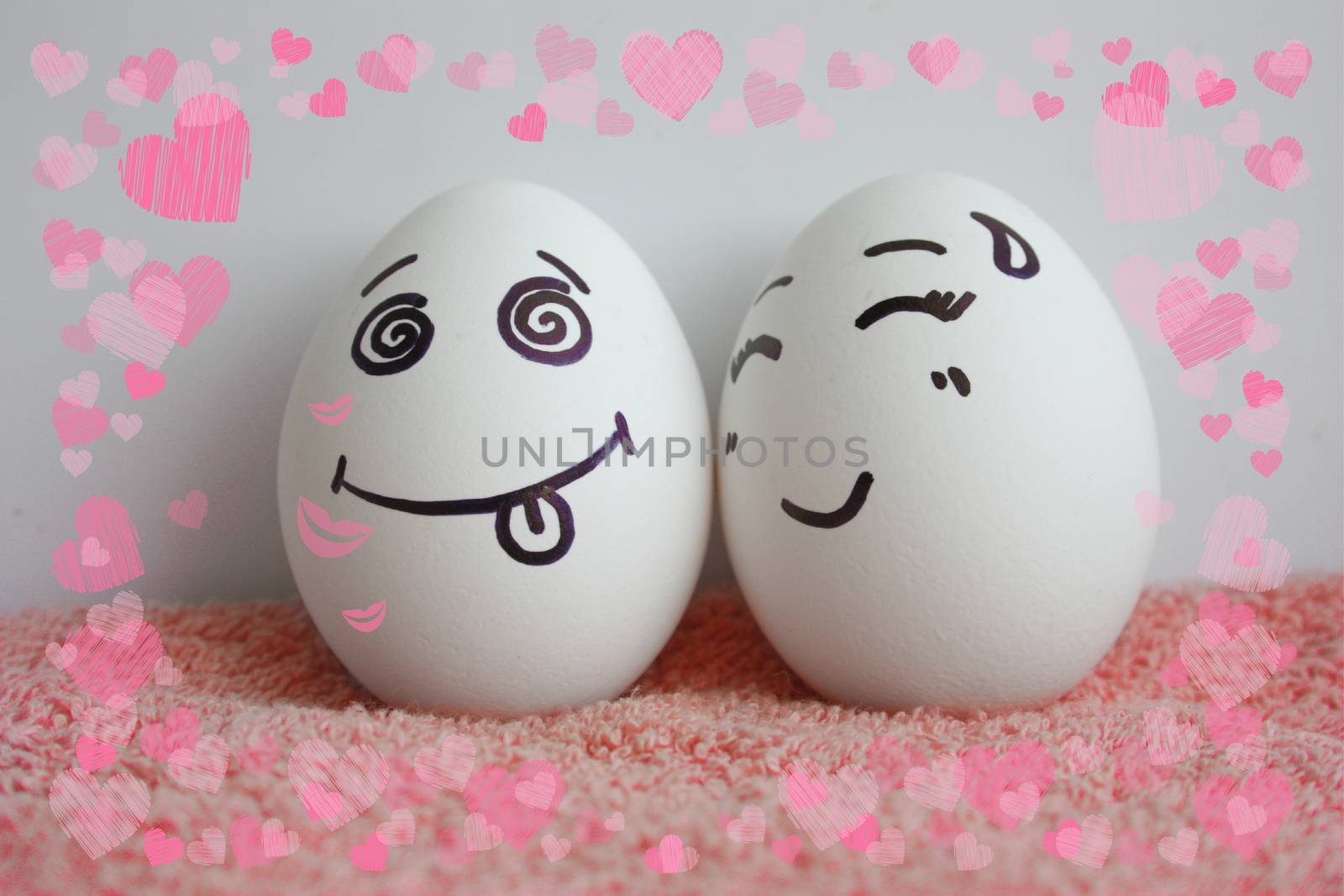 Eggs are cheerful with a face. Two pieces. The concept of living the soul in the soul. Photo for your design Frame of hearts. love