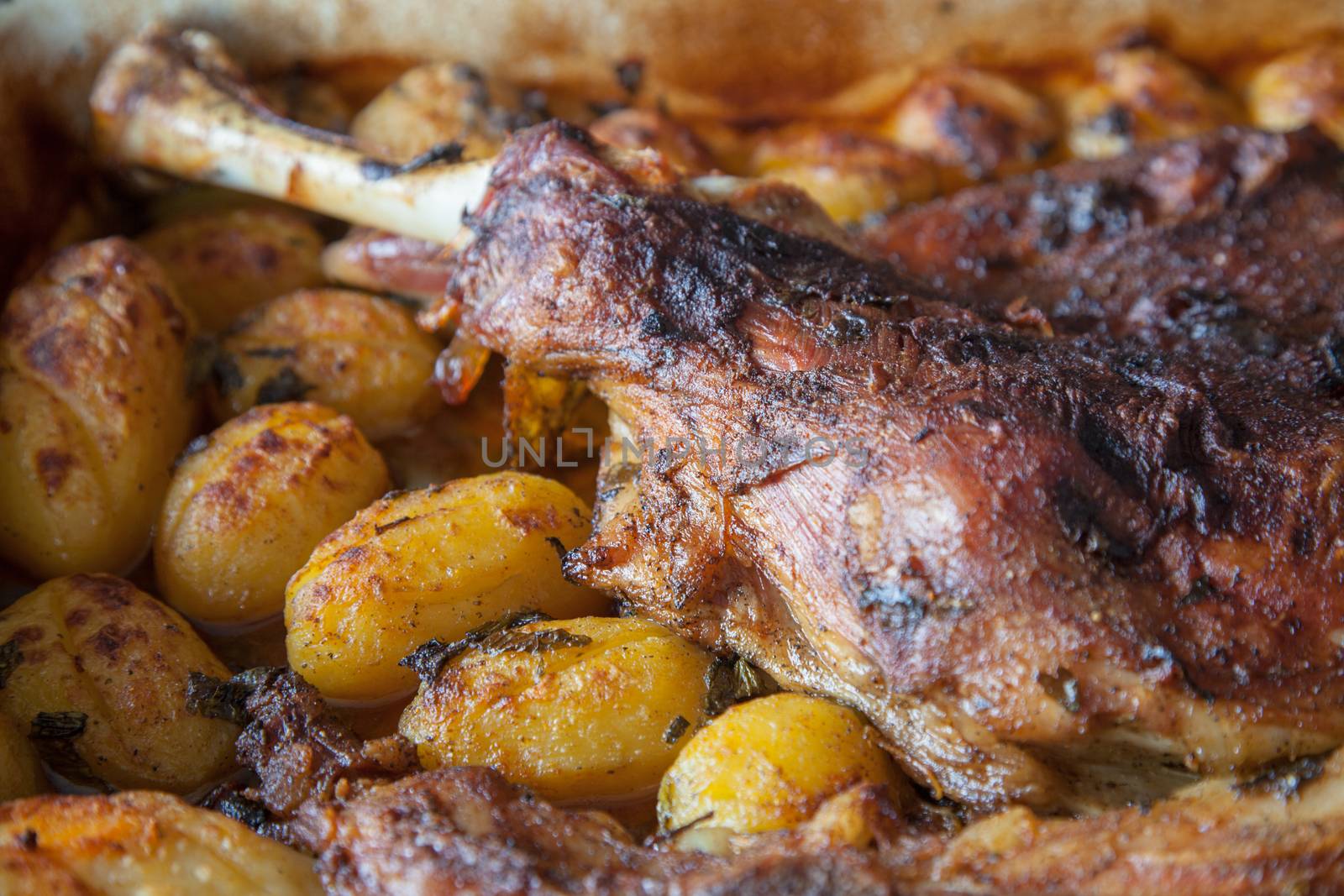 Delicious lamb shoulder, roasted with whole potatoes.